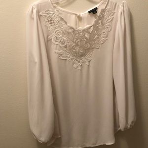 White blouse with embroidered neckline -